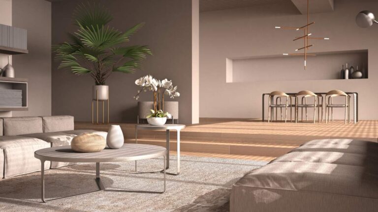 A couple using a wall-mounted smart home control panel in a modern, spacious living room.